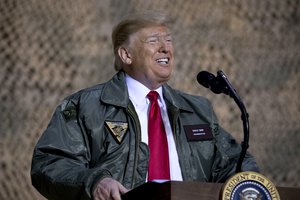 President Donald Trump speaks at a hanger rally at Al Asad Air Base, Iraq, Wednesday, Dec. 26, 2018.