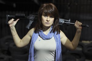 File - In this photo taken on Sunday, April 22, 2012, Maria Butina, a gun-rights activist, poses for a photo at a shooting range in Moscow, Russia. When gun activist Maria Butina arrived in Washington in 2014 to network with the NRA, she was peddling a Russian gun rights movement that was already dead.