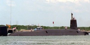 File - A port quarter view of the British nuclear-powered ballistic missile submarine HMS Vanguard arriving in Port Canaveral, Florida.