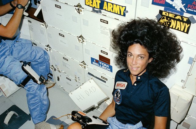 Astronaut Judy Resnik floats in the mid-deck of Space Shuttle Discovery during mission STS-41D.