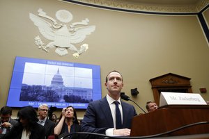 In this April 11, 2018 file photo, Facebook CEO Mark Zuckerberg returns after a break to continue testifying at a House Energy and Commerce hearing on Capitol Hill in Washington, about the use of Facebook data to target American voters in the 2016 election and data privacy.