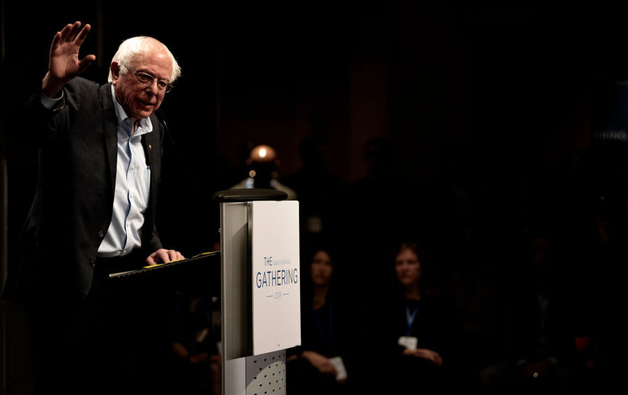 Bernie Sanders speaking at podium