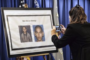 A reporter takes a photo of Mark Domingo, 26, from Reseda, Calif., displayed at a news conference in Los Angeles on Monday, April 29, 2019