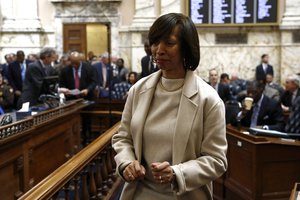 Baltimore Mayor Catherine Pugh walks on the Maryland House of Delegates chamber floor before Gov. Larry Hogan's annual State of the State address to a joint session of the legislature in Annapolis, Md., Wednesday, Jan. 30, 2019.