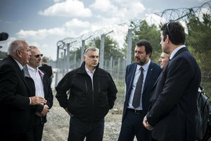 In this handout photo provided by the Hungarian Prime Minister's Press Office shows Hungarian Prime Minister Viktor Orban, center, Italian Interior Minister Matteo Salvini, third right, and Hungarian Interior Minister Sandor Pinter, second left, during their visit at the Hungarian-Serbian border near Roszke, 180 kms southeast of Budapest, Hungary, Thursday, May 2, 2019.