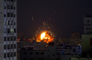 An explosion caused by an Israeli airstrike on a building in Gaza City, Saturday, May 4, 2019