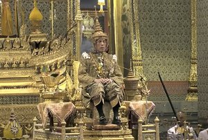 In this image made from video, Thailand’s King Maha Vajiralongkorn sits on the throne in front of an audience of diplomats and dignitaries after being officially crowned king at the Grand Palace, Saturday, May 4, 2019, in Bangkok, Thailand.