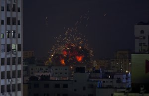 An explosion caused by an Israeli airstrike on a building in Gaza City, Saturday, May 4, 2019.