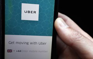 FILE - In this Friday, Sept. 22, 2017 file photo, an Uber App is displayed on a phone in London.