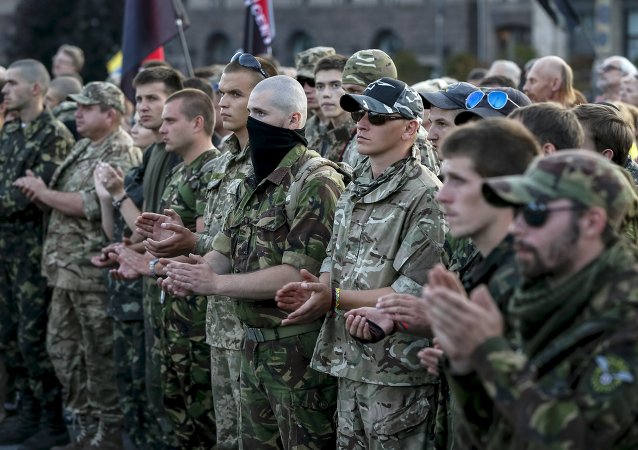 Members of the far-right radical group Right Sector and their supporters attend an anti-government rally in Kiev, Ukraine, July 21, 2015