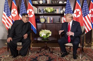 Donald Trump and Kim Jong-un talking in Capella Hotel, during the Singapore summit