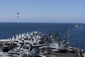 File - Two MH-60S Sea Hawk helicopters from the "Nightdippers" of Helicopter Sea Combat Squadron 5 transport cargo from the fast combat support ship USNS Arctic to the flight deck of the Nimitz-class aircraft carrier USS Abraham Lincoln, Mediterranean Sea, 29 April, 2019.