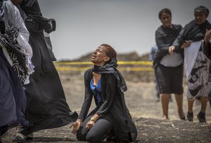 Ethiopian relatives of crash victims mourn and grieve at the scene where the Ethiopian Airlines Boeing 737 Max 8 crashed shortly after takeoff on Sunday killing all 157 on board, near Bishoftu, south-east of Addis Ababa, in Ethiopia Thursday, March 14, 2019.