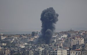 Smoke rises from an explosion after an Israeli airstrike in Gaza City, Sunday, May 5, 2019