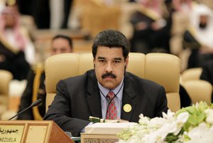 Venezuelan President Nicolas Maduro listens during the final session summit of Arab and South American leaders in Riyadh, Saudi Arabia, Wednesday, Nov. 11, 2015.