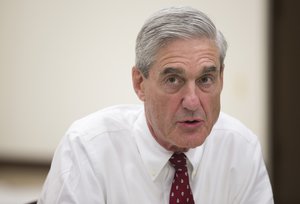 Outgoing FBI director Robert Mueller speaks during an interview at FBI headquarters on Wednesday, Aug. 21, 2013, in Washington.