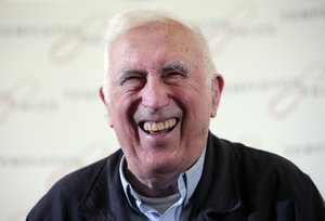 FILE - In this March 11, 2015 file photo, Jean Vanier, the founder of L'ARCHE, an international network of communities where people with and without intellectual disabilities live and work together, laughs during a news conference, in central London.