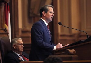 Georgia Gov. Brian Kemp, right, speaks to members of the Georgia House as House Speaker David Ralston looks on during the final 2019 legislative session at the State Capitol Tuesday, April 2, 2019, in Atlanta