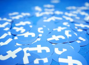 Facebook stickers are laid out on a table at F8, the Facebook's developer conference, Tuesday, April 30, 2019, in San Jose, Calif.