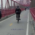 Here’s a series of photos capturing a walk over Williamsburg bridge into Manhattan from Brooklyn, New York. Check out the dude in shades and leather jacket skateboarding by.