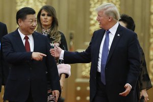 File - U.S. President Donald Trump China's President Xi Jinping arrive for the state dinner with the first ladies at the Great Hall of the People in Beijing, China, Thursday, Nov. 9, 2017.