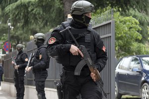 Montenegro police officers guard the entrance to the court during the verdict in the case of ''attempted terrorism'' and ''creating a criminal organization'', in Podgorica, Montenegro, Thursday, May 9, 2019