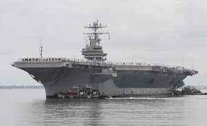 The nuclear powered aircraft carrier Abraham Lincoln arrives at Naval Station Norfolk in Norfolk, Va., Tuesday, Aug. 7, 2012.