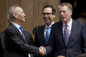 Treasury Secretary Steve Mnuchin, center, and United States Trade Representative Robert Lighthizer, right, speak with Chinese Vice Premier Liu He, left, as he departs the Office of the United States Trade Representative in Washington, Friday, May 10, 2019.