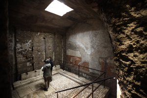 People walk in the Domus Transitoria, the first imperial palace of Roman Emperor Nero on the Palatine Hill in Rome, during its opening for the press, Thursday, April 11, 2019