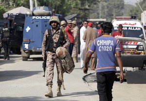 Pakistani security personnel arrive at the Chinese Consulate in Karachi, Pakistan, Friday, Nov. 23, 2018