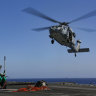 A Sea Hawk helicopter prepares to take a load on the flight deck of aircraft carrier USS Abraham Lincoln in the Persian Gulf on Friday.