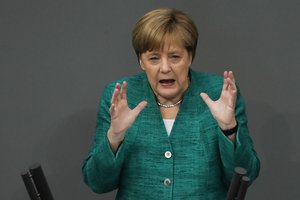 German Chancellor Angela Merkel delivers her speech during a debate at the German parliament Bundestag in Berlin, Thursday, June 28, 2018.