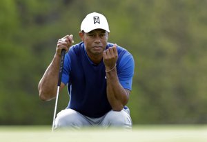 Tiger Woods lines up a putt on the 10th green during the first round of the PGA Championship golf tournament, Thursday, May 16, 2019, at Bethpage Black in Farmingdale, N.Y.