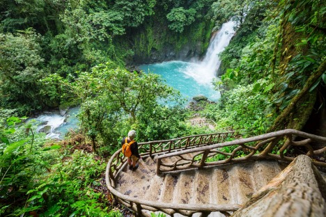 Majestic waterfall in the rainforest jungle of Costa Rica.