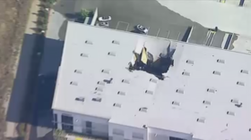 Armed F-16 jet crashes into warehouse as pilot ejects at California military base (PHOTOS, VIDEO)