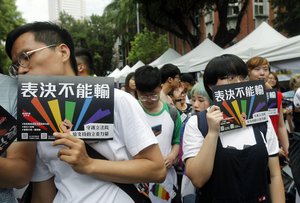 Same-sex marriage supporters gather outside the Legislative Yuan in Taipei, Taiwan, Friday, May 17, 2019.