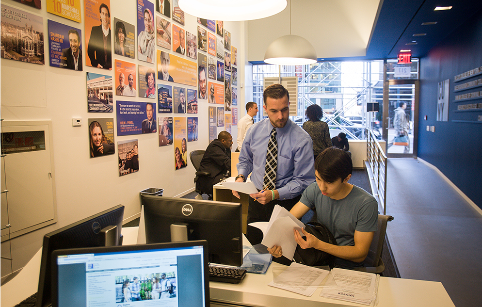 Peter Engel (standing) with prospective student a the CUNY Welcome Center on 42nd Street