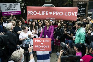 File - Ashley Garecht speaks as anti-abortion protesters rally near a Planned Parenthood clinic in Philadelphia, Friday, May 10, 2019.