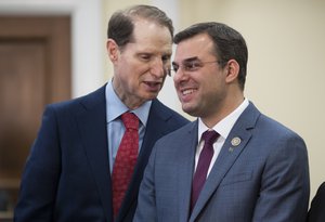 Sen. Ron Wyden, D-Ore., left, a member of the Senate Intelligence Committee, confers with Rep. Justin Amash, R-Mich., as they hold a news conference with a bipartisan group of House and Senate lawmakers who are demanding the U.S. government should be required to seek warrants if it wants to search for information about Americans and insist on reforms to the FISA Amendments Reauthorization Act of 2017 to protect Americans' rights, at the Capitol in Washington, Wednesday, Jan. 10, 2018.