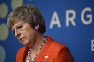 Britain's Prime Minister Theresa May listens to a question during a press conference after the G20 Leader's Summit in Buenos Aires, Argentina, Saturday, Dec. 1, 2018