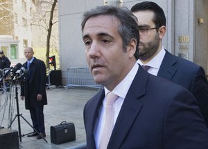 File - Michael Avenatti, Stormy Daniels' attorney, left, watches as Michael Cohen, center, President Donald Trump's personal attorney, leaves federal court in New York, Thursday, April 26, 2018.