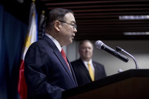 Philippines Foreign Secretary Teodoro Locsin Jr., left, accompanied by U.S. Secretary of State Mike Pompeo, right, speaks at a news conference at the Philippines Department of Foreign Affairs Home Office in Manila, Philippines, Friday, March 1, 2019.