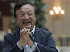 Ren Zhengfei, founder and CEO of Huawei, smiles during a round table meeting with the media in Shenzhen city, south China's Guangdong province, Tuesday, Jan. 15, 2019