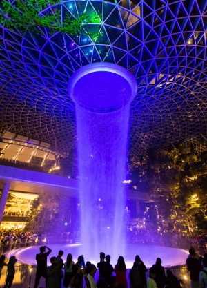 A Rain Vortex Light and Sound show in the night at Jewel Changi Airport, Singapore.