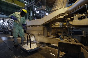 In this May 31, 2012 file photo, an Iranian worker works at the Mobarakeh Steel Complex, some 280 miles (460 kilometers) south of the capital Tehran, and some 40 miles, 65 kilometers, southwest of central Iranian city of Isfahan