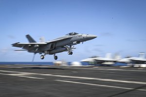 An F/A-18E Super Hornet from "the Fist of the Fleet" of Strike Fighter Squadron (VFA) 25 lands on the flight deck of the Nimitz-class aircraft carrier USS Abraham Lincoln (CVN 72), Arabian Sea, 20 May, 2019.