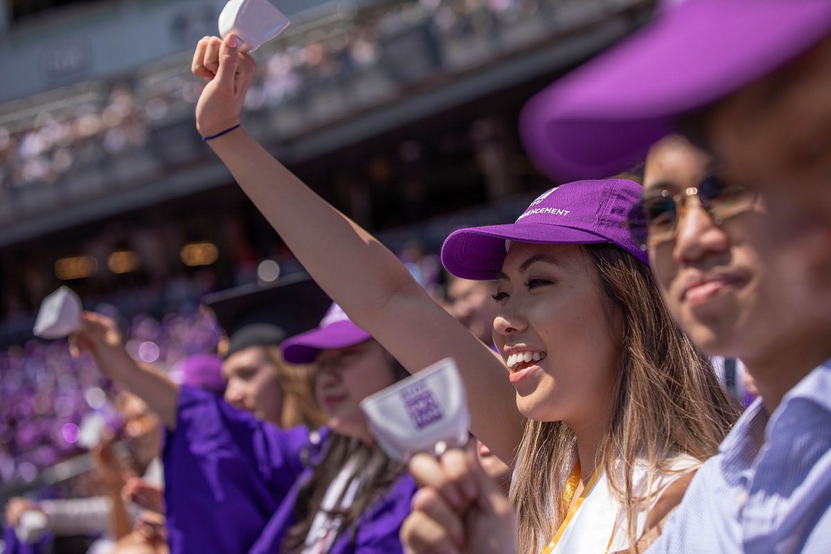 graduates celebrating at Yankee Stadium