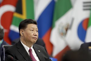 China's President Xi Jinping waits for the start of the G20 summit in Buenos Aires, Argentina, Friday, Nov. 30, 2018.