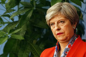 Britain's Prime Minister Theresa May listens as the declaration at her constituency is made for in the general election in Maidenhead, England, Friday, June 9, 2017.