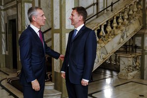 File - NATO Secretary General Jens Stoltenberg with Jeremy Hunt, UK Secretary of State for Foreign and Commonwealth Affairs during his visit to the United Kingdom, 14 May. 2019